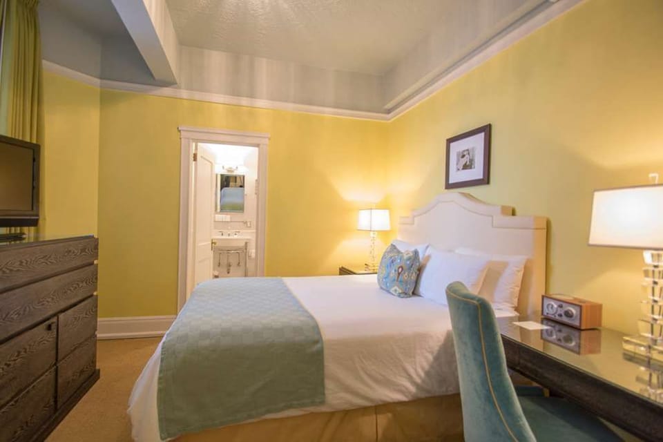 Spacious queen room designed for relaxation, featuring contemporary furnishings and a serene atmosphere.