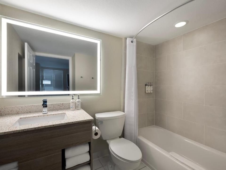 Refresh in a spotless bath with bright, spa-like mirror.