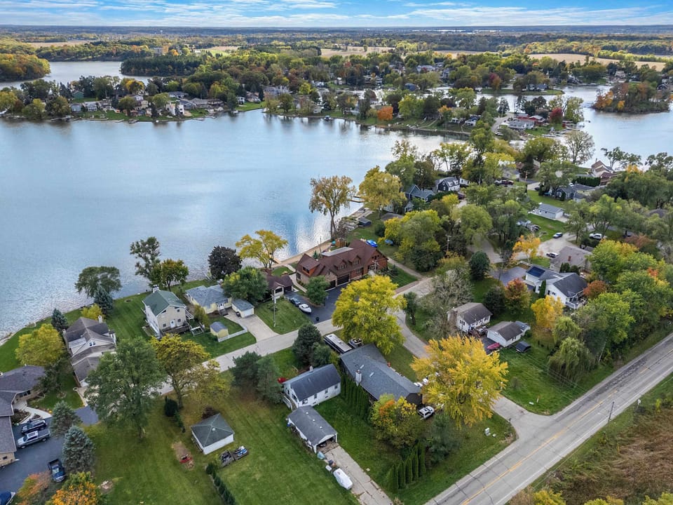 Enjoy 120ft of private beachfront on Lake Shangrila with kayaks, canoes, paddle boards, beach toys, & sun loungers - as well as the hot tub, fire pit, dining/lounge set, basketball hoop, corn hole, connect 4, giant jenga, & propane gas grill.