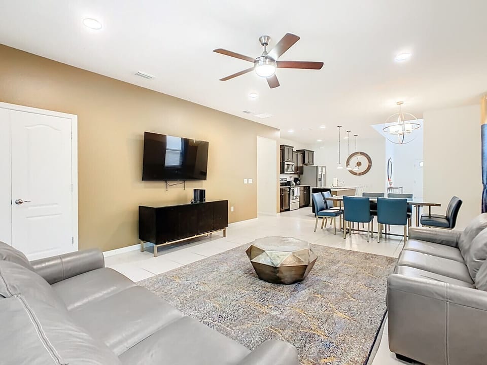 Refined living room with plush seating, smart TV, and contemporary décor.