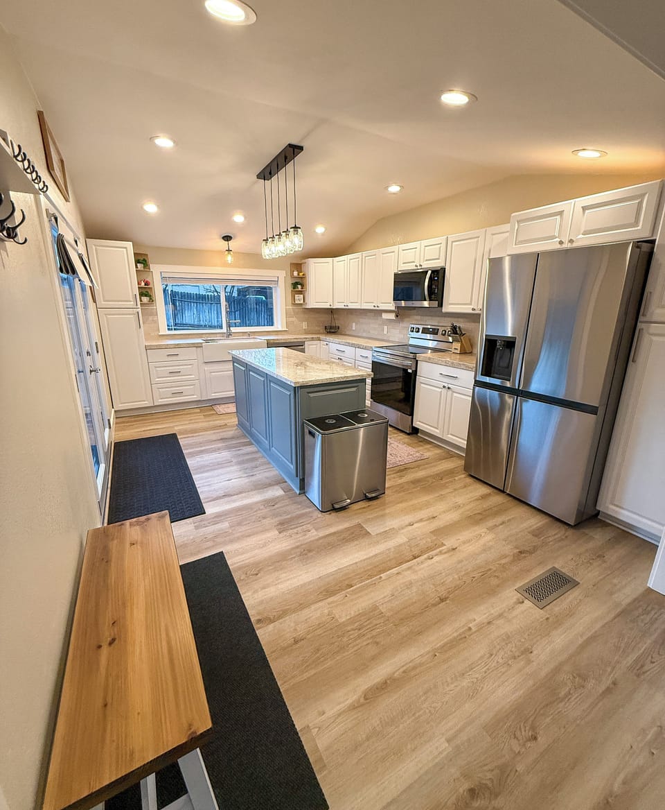 Chef's kitchen with quartzite counter tops, granite island, & new appliances