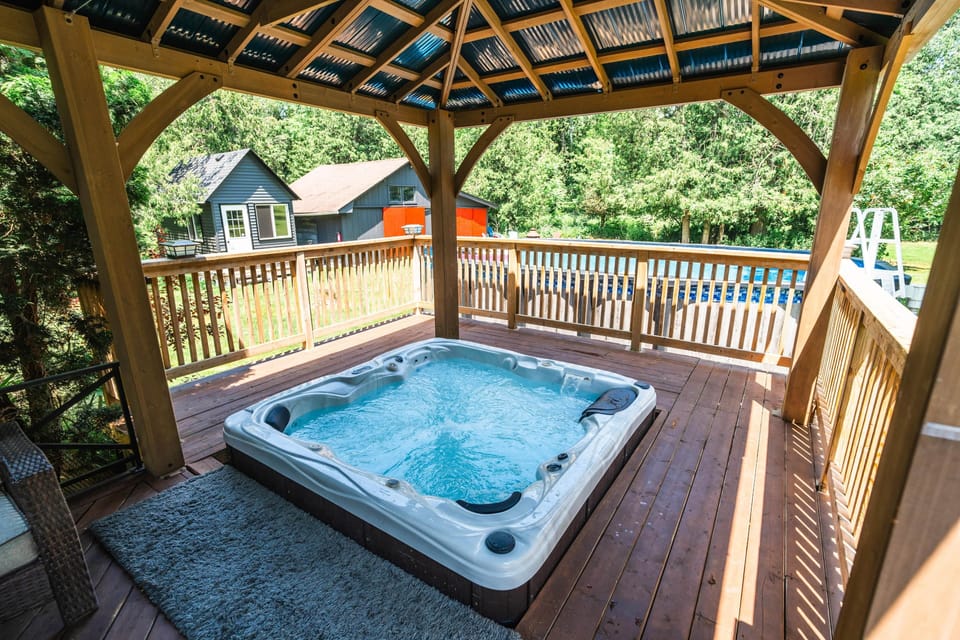 A relaxing hot tub under a covered gazebo, your private spa moment