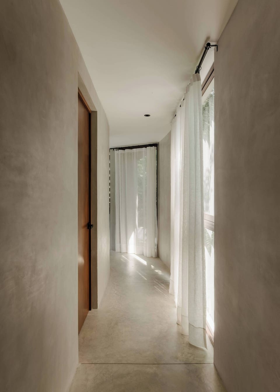 Long hallways and natural light give the villa an airy, open feel throughout.