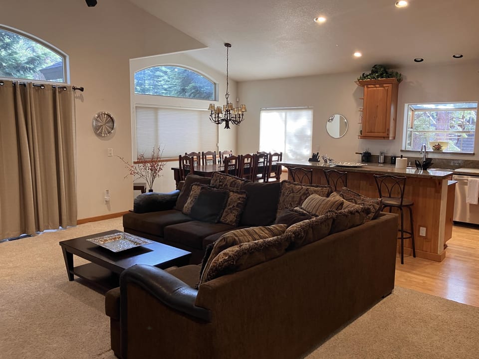 Living room, kitchen and dining room from entry way stairs.