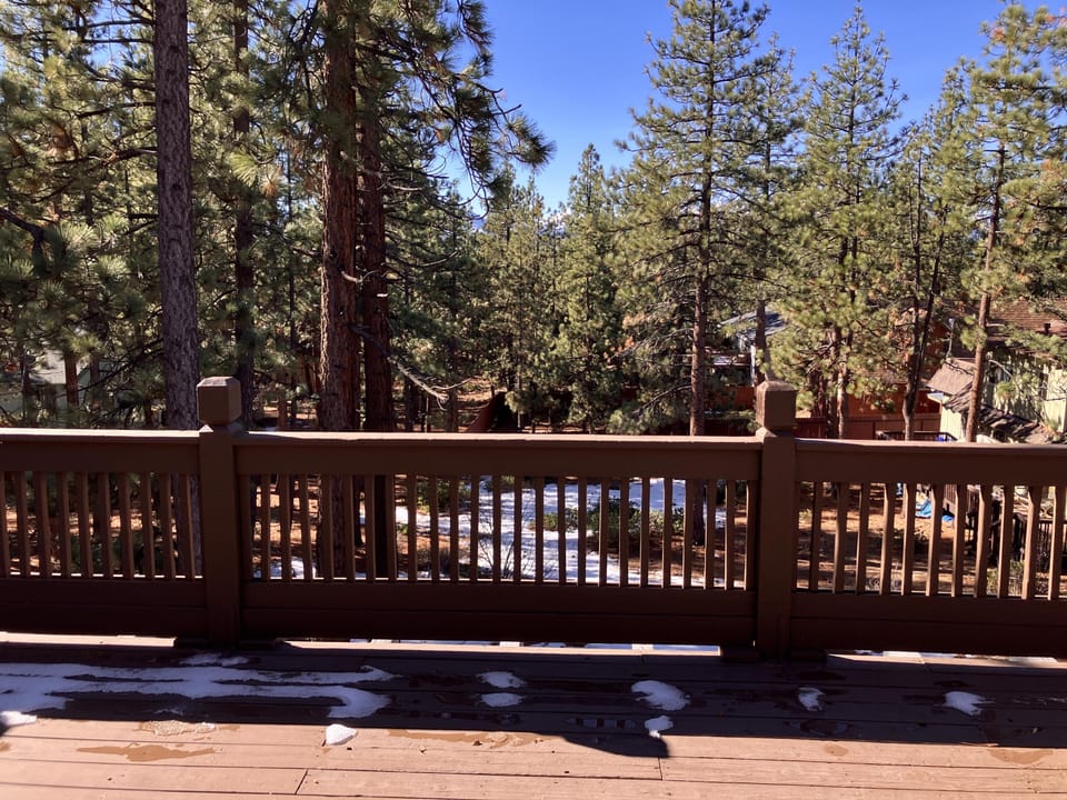 Back Deck with wooded and mountain views. 