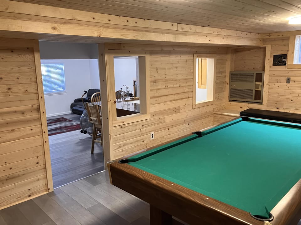 Pool table in game room.