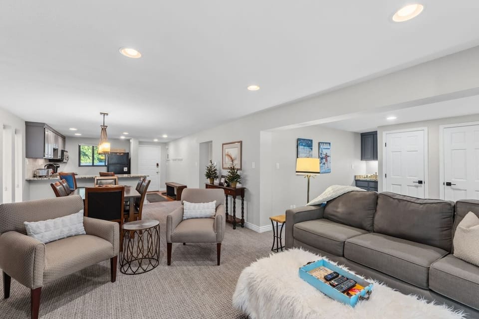 Cozy living room with smart TV, fireplace, and walkout deck