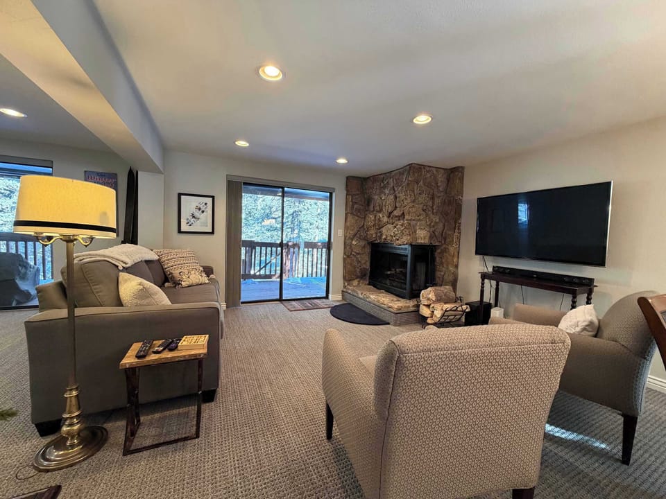 Living room with access to large deck space