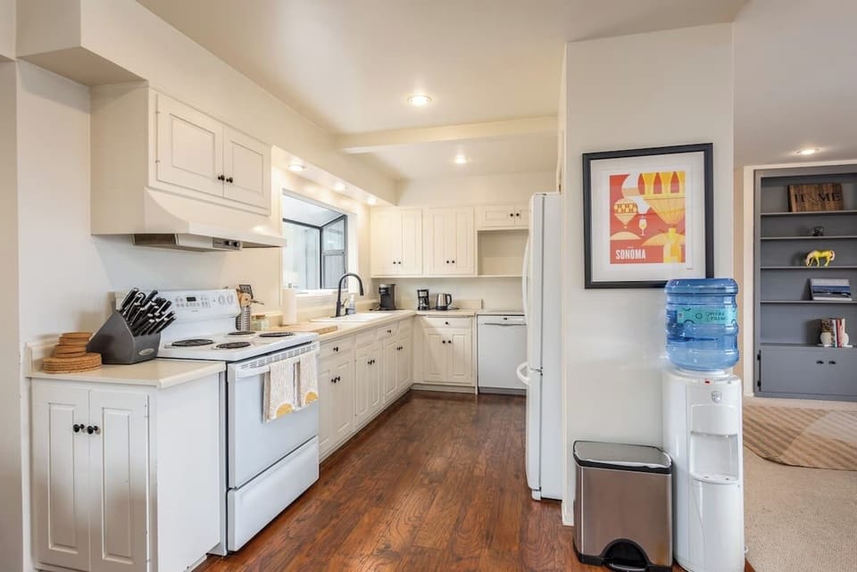 Warm, inviting kitchen with classic cabinetry and modern essentials—ideal for easy meals, morning coffee, and gathering with loved ones.
