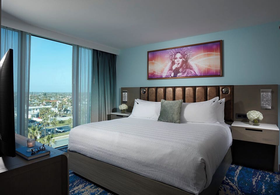 Unwind in crisp linens with calming city views.