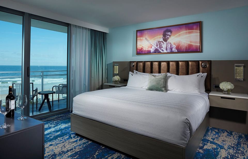 Toast sunsets from bed with sweeping oceanfront balcony views.