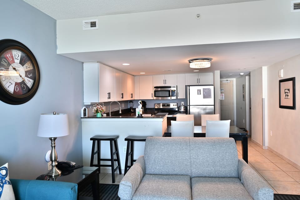 Open-concept living space with modern kitchen and cozy seating.