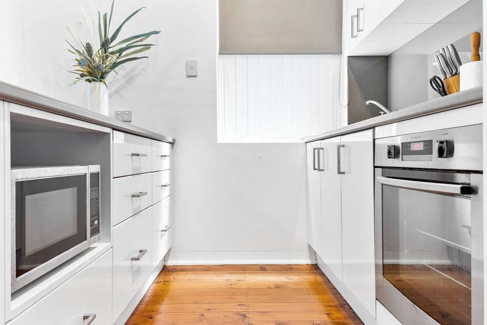 Kitchen with stove, oven, microwave, and fridge