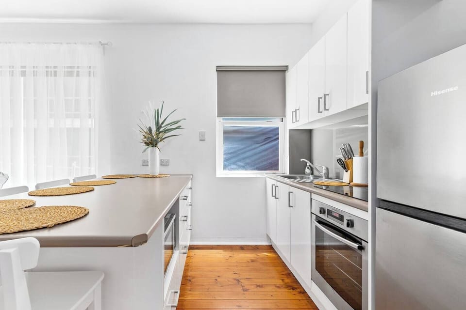 Kitchen with stove, oven, microwave, and fridge