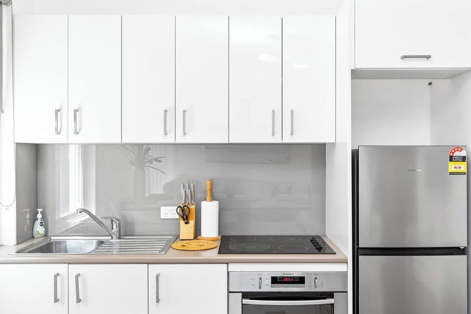 Kitchen with stove, oven, microwave, and fridge