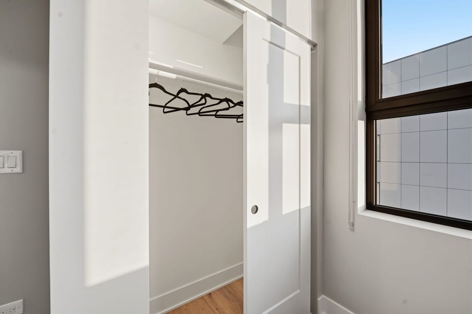 Simple closet area offering space to unpack & settle in