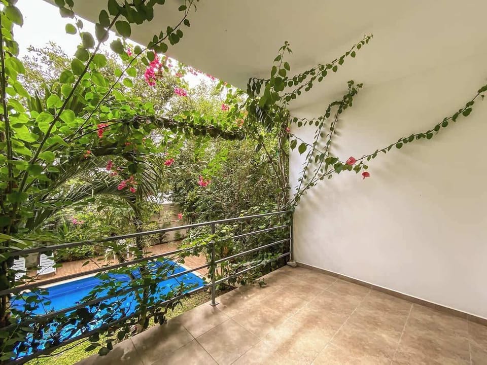 Living room with sofa and balcony access