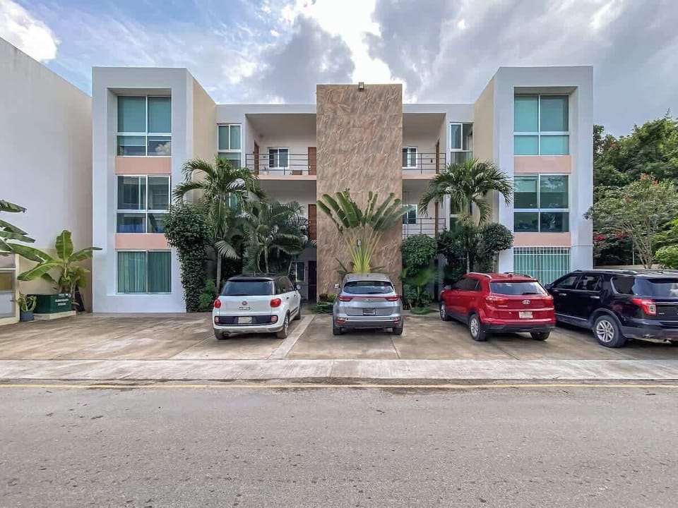 Condominium building exterior with parking