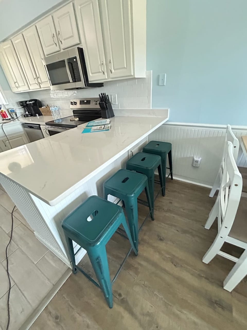 Bright modern kitchen with quartz breakfast bar and seating for four
