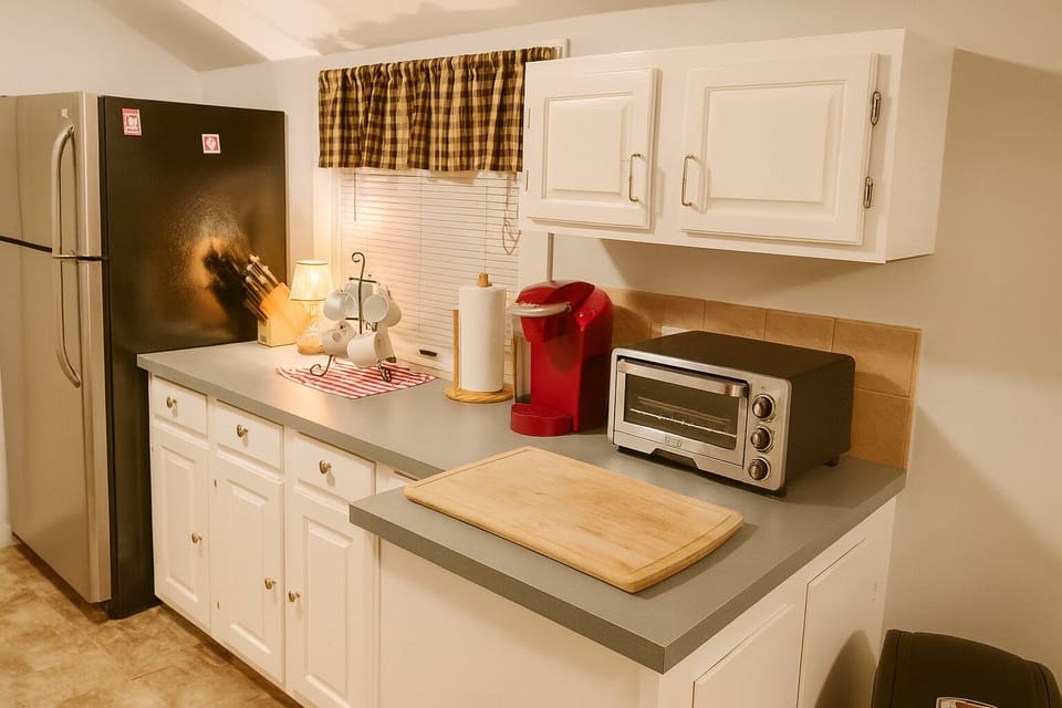 Bright kitchen with coffee station and full fridge—perfect for family meals