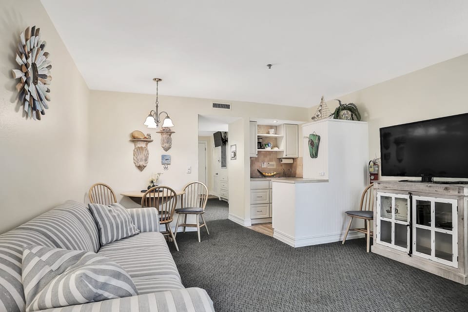 The open floor plan allows the living room, kitchen, and dining area to be shared for enjoyment.