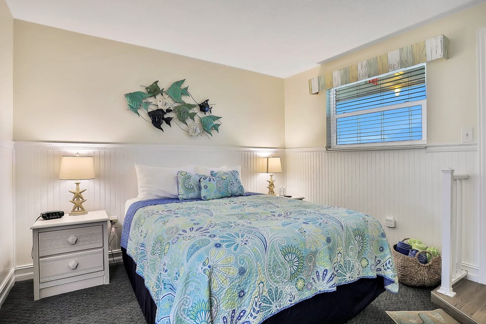 The bedroom has a queen size bed.