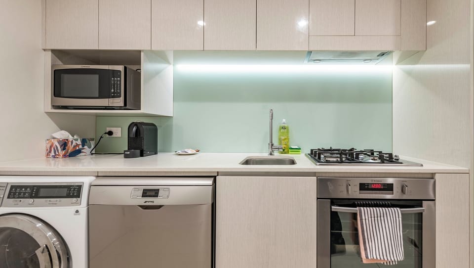 Fully equipped kitchen with modern appliances and ample bench space