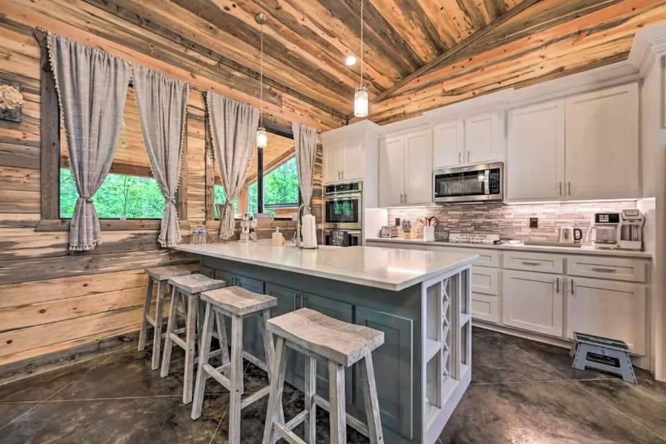 Open kitchen with rustic wood finishes and modern appliances