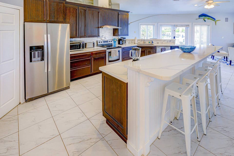 The spacious kitchen island is perfect for meal prep, casual dining, or grabbing a quick snack before your next adventure.