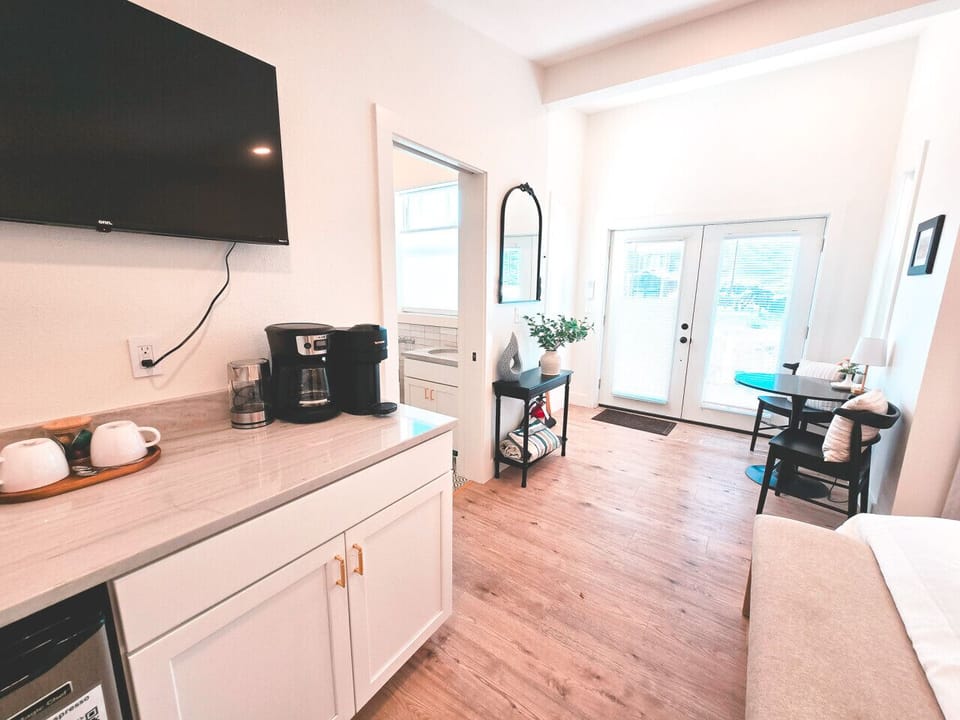 Kitchenette with coffee cups, microwave, toaster