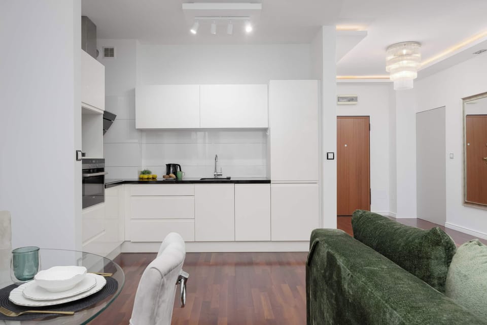 Inviting dining corner with an elegant table setting and green seating.
