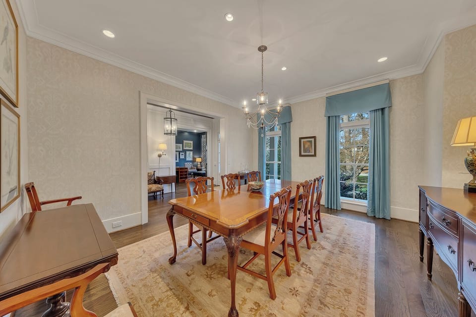 Dining area w/ chandelier & soft light, creating a warm setting for gatherings