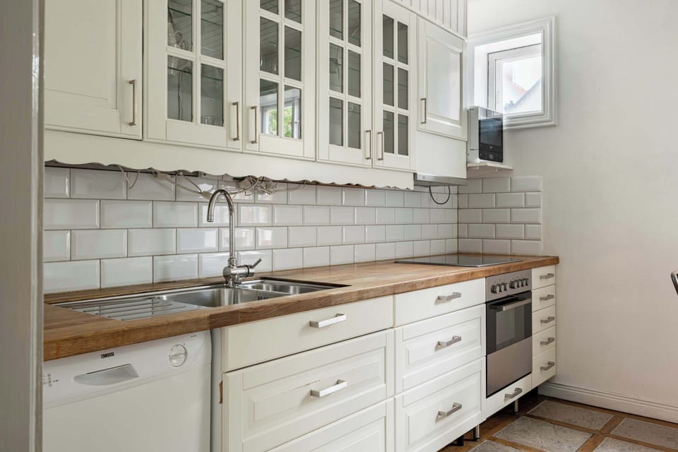 The kitchen that is fully equipped with all essentials you will need for a home cooked meal. There is a stove, oven, microwave, kettle, coffee maker, fridge, freezer and dishwasher