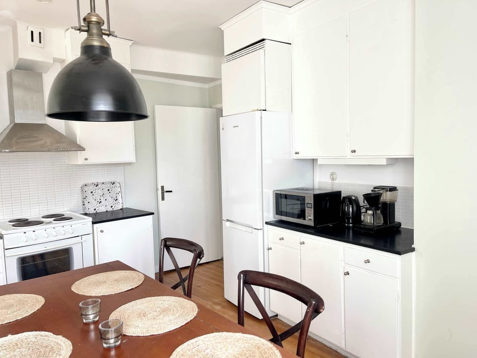 The dining table located in the kitchen that accommodates 6 guests.