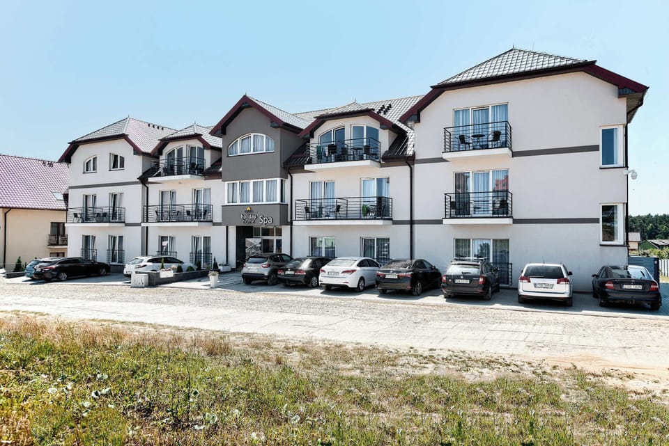 A multi-building residential complex with balconies and uniform architecture.