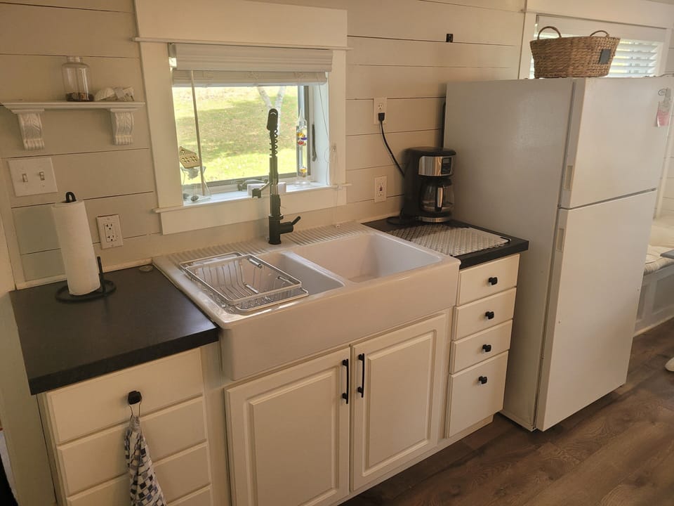 KITCHEN:  Overview of the kitchen, which has all appliances except for a dishwasher.  Also has a good supply of cooking and dining utensils.