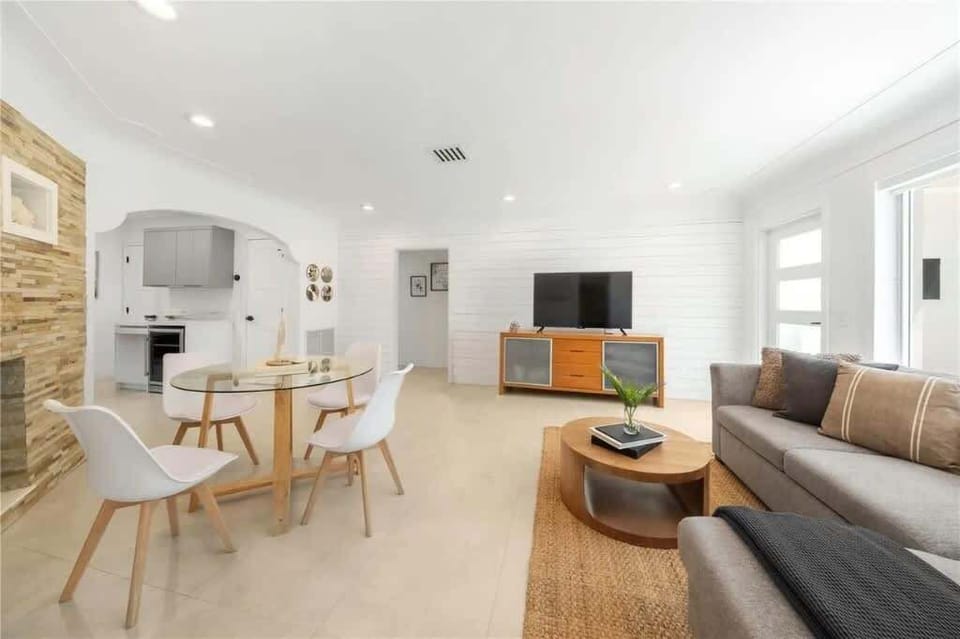 Dine and unwind in this bright, modern space—featuring a cozy living area, sleek dining nook, and minimalist design. Ideal for vacation rental guests who appreciate comfort, style, and open-concept living. Your stylish stay starts here!