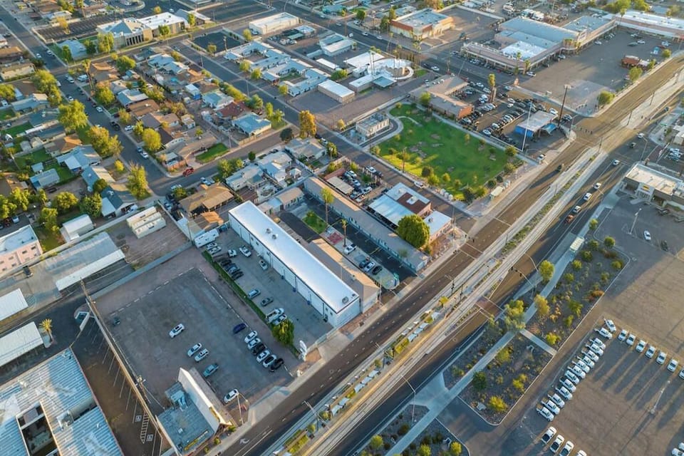 Discover easy city access with nearby streets and open green space.