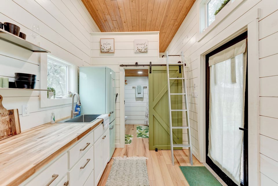 The bathroom and second bedroom are at the right end of the kitchenette