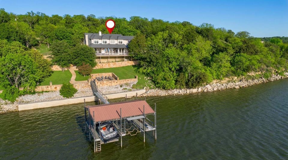 When your stay looks this good from the sky, imagine how relaxing it feels up close. House above, dock below, paradise everywhere.