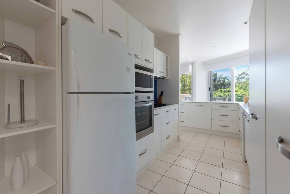 The kitchen provides ample space to store your groceries and prepare meals at home.
