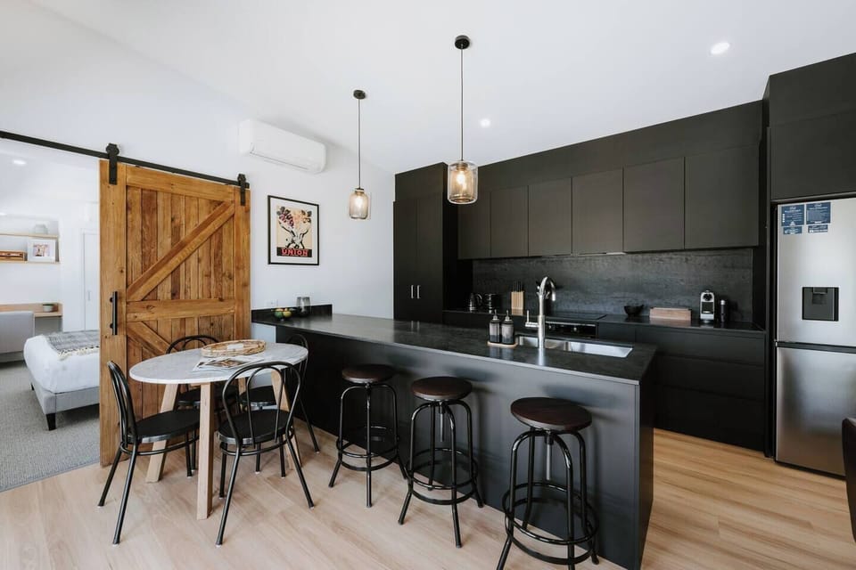 A round dining table offers an intimate setting for lingering meals and shared moments.