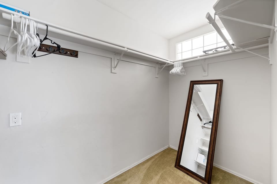 Walk-in closet with full-length mirror