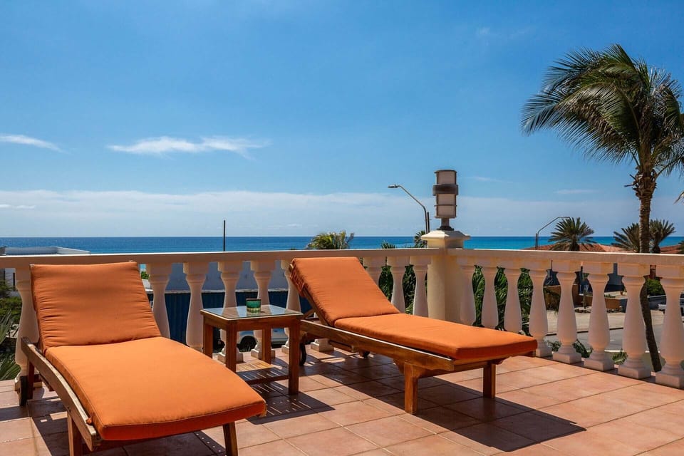 Ocean view balcony with lounge chairs