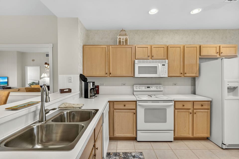 Kitchen with modern appliances and ample counter space.