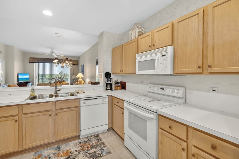 Fully equipped kitchen with modern appliances and counter space.