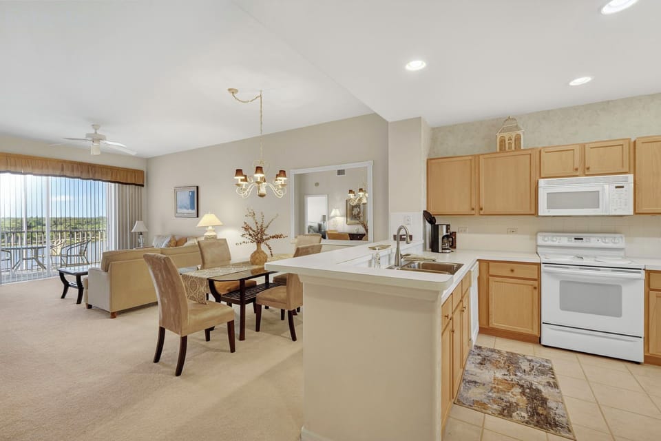 Open-concept kitchen, dining, and living area.
