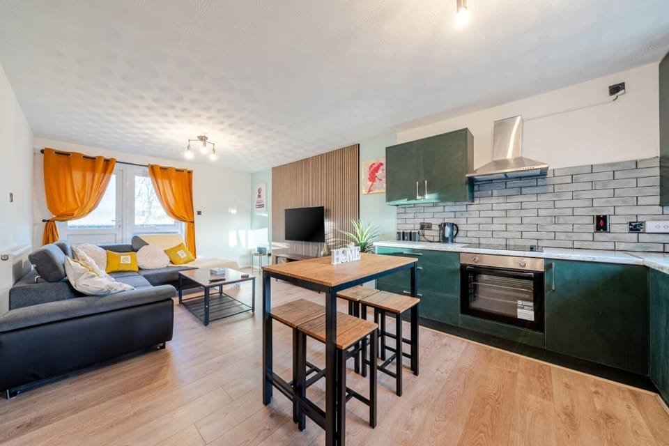 Full view of living, dining and kitchen space