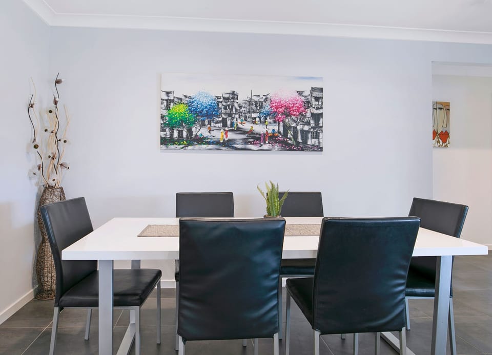 Gather around the six-seat dining table for shared meals, board games, or planning the day.