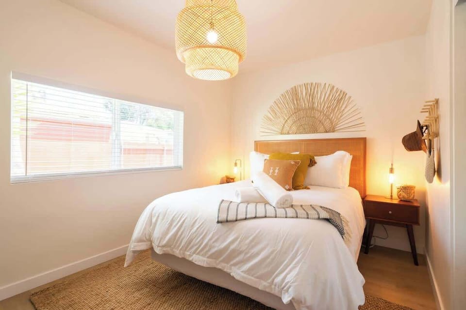 The warm and inviting master bedroom with a luxe queen bed